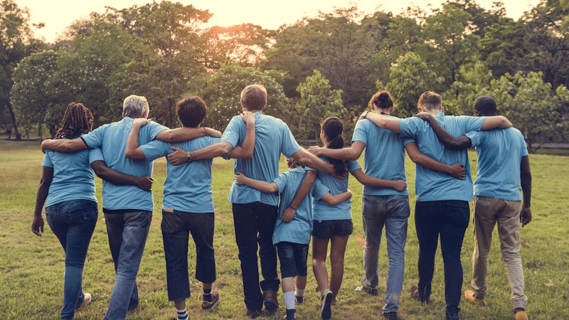 Group of volunteers walking from behind